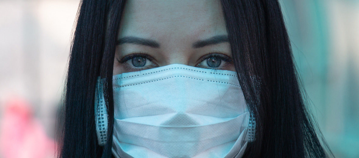 Young woman wearing COVID-19 mask